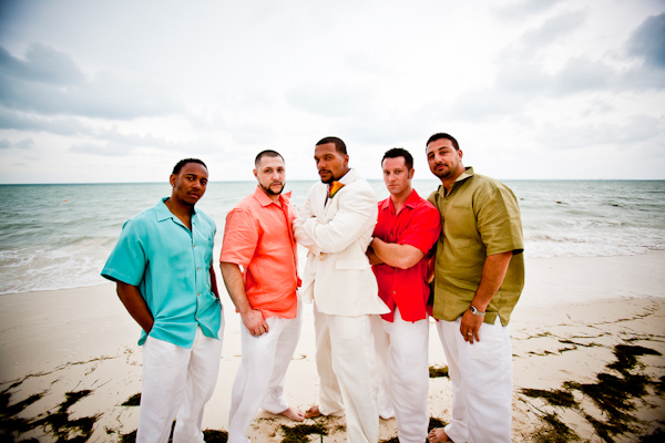Tropical wedding with groom and colorful groomsmen, photo by JAGstudios